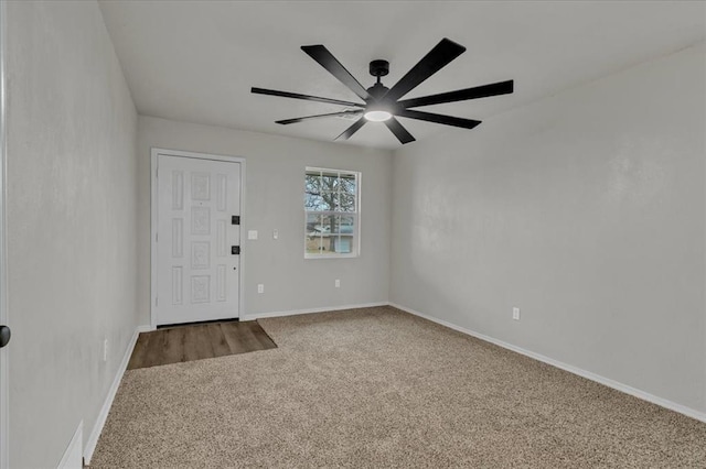 empty room with carpet flooring and ceiling fan