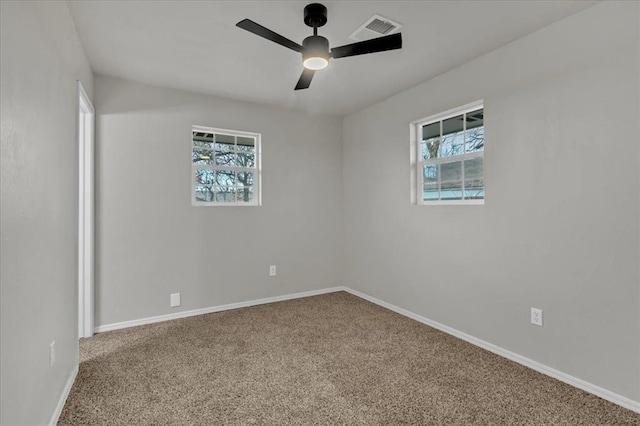 unfurnished room featuring ceiling fan and carpet floors