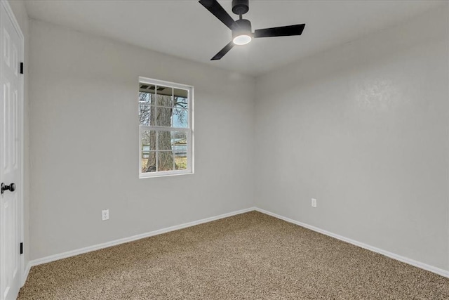 spare room with ceiling fan and carpet flooring