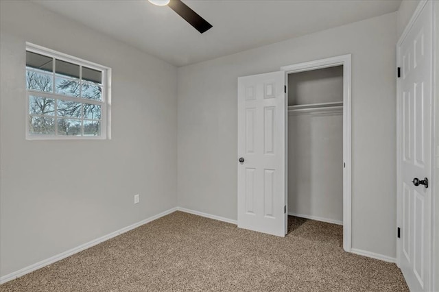 unfurnished bedroom featuring light carpet, ceiling fan, and a closet