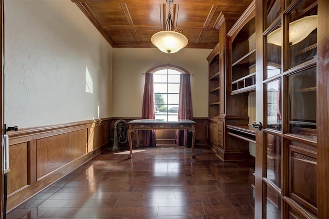 unfurnished office featuring wood ceiling, ornamental molding, and dark wood-type flooring