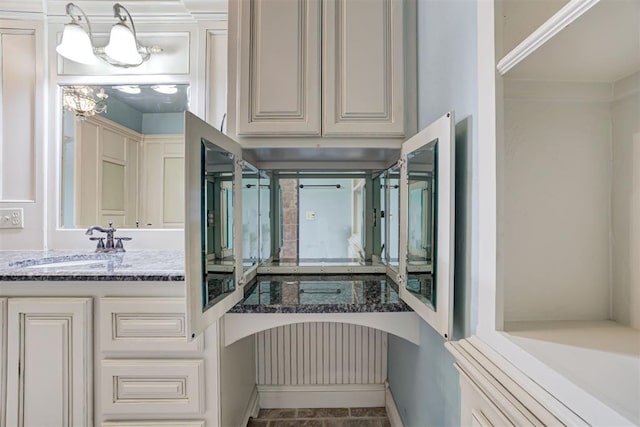 bathroom featuring vanity and crown molding