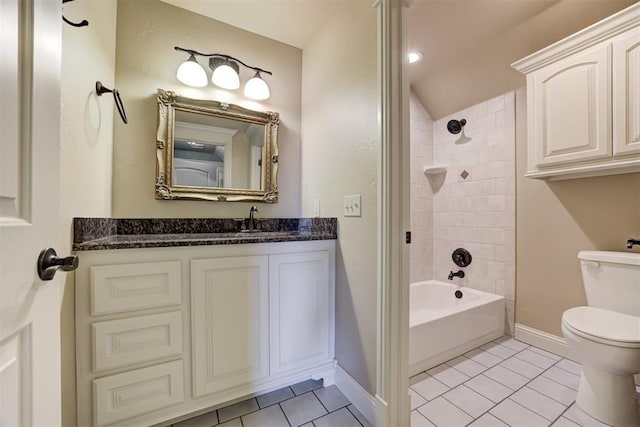 full bathroom with vanity, tile patterned floors, toilet, and tiled shower / bath