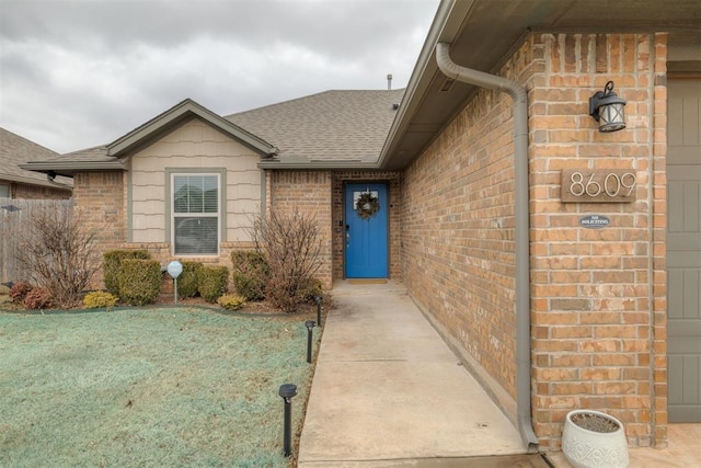 property entrance featuring a yard