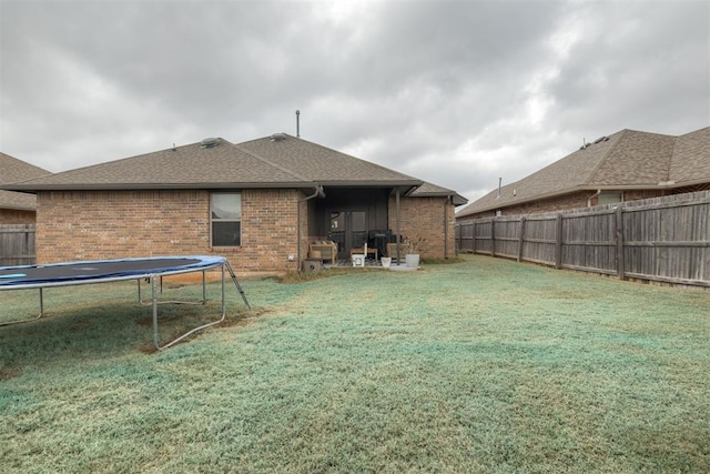 8609 SW 36th Ter, Oklahoma City, OK 73179 - fenced backyard with a trampoline