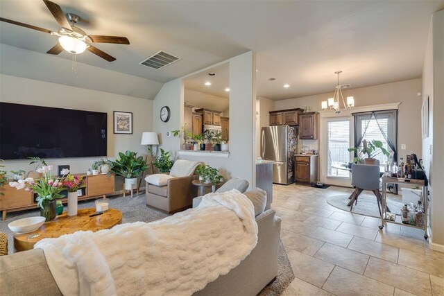 8609 SW 36th Ter, Oklahoma City, OK 73179 - living room featuring a chandelier, ceiling fan, and recessed lighting