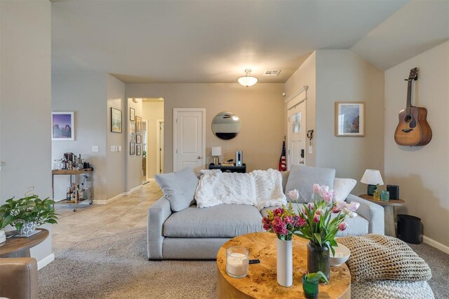 8609 SW 36th Ter, Oklahoma City, OK 73179 - living area featuring carpet flooring and tile patterned floors