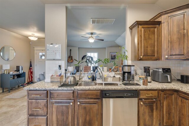 8609 SW 36th Ter, Oklahoma City, OK 73179 - kitchen featuring dishwasher, tasteful backsplash, a ceiling fan, vaulted ceiling, and light stone counters