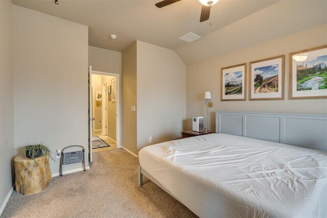 8609 SW 36th Ter, Oklahoma City, OK 73179 - bedroom with light carpet, lofted ceiling, and a ceiling fan