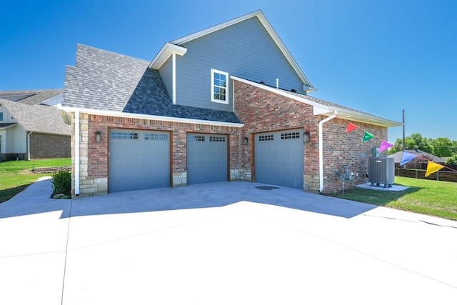 1909 Carleton Ln, Shawnee, OK 74804 - view of side of home with brick siding, a garage, concrete driveway, central AC unit, and roof with shingles