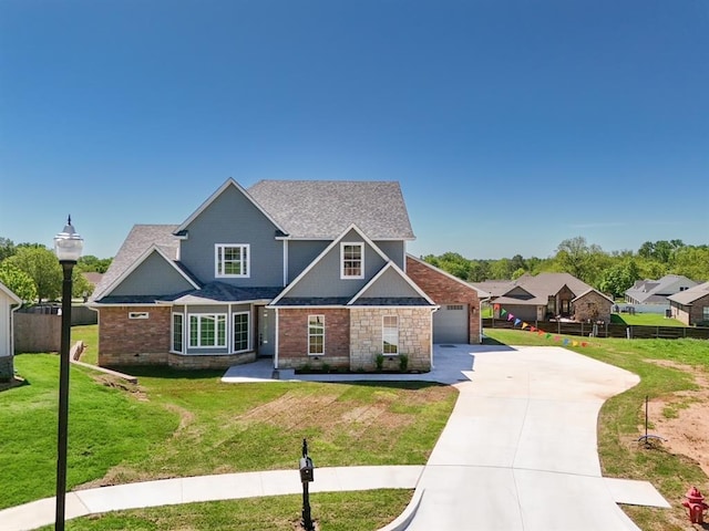 1909 Carleton Ln, Shawnee, OK 74804 - craftsman house featuring concrete driveway, fence, a front lawn, and an attached garage