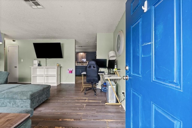 office space featuring dark hardwood / wood-style floors and a textured ceiling