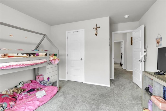 bedroom featuring light colored carpet