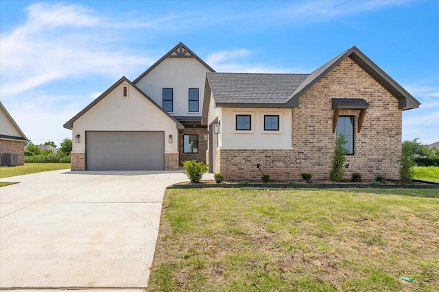 3305 Sugar Maple Way, Oklahoma City, OK 73179 - view of front of property featuring driveway, brick siding, stucco siding, a front lawn, and a garage