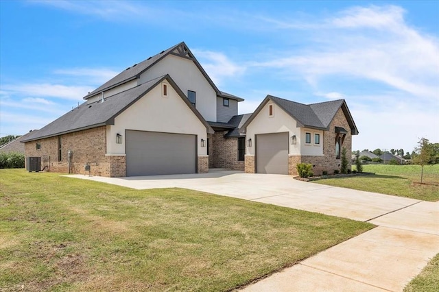 3305 Sugar Maple Way, Oklahoma City, OK 73179 - view of front facade with brick siding, a garage, a front yard, driveway, and stucco siding