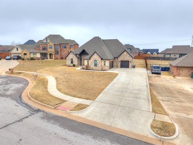 french provincial home featuring a garage and a front yard