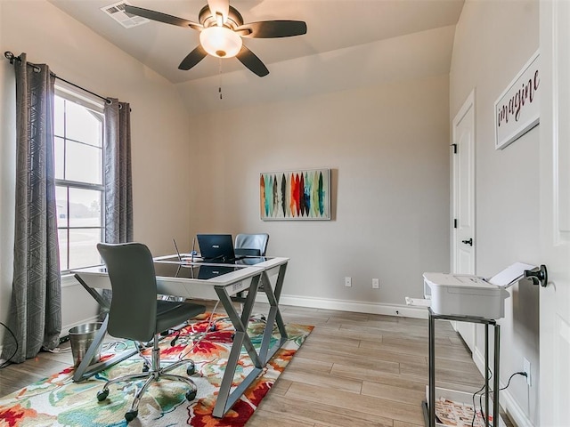 office featuring lofted ceiling, light hardwood / wood-style flooring, and ceiling fan