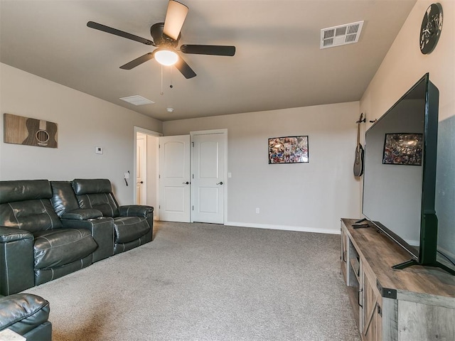 carpeted living room with ceiling fan