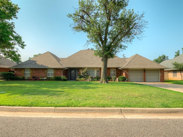 ranch-style home with a garage and a front yard