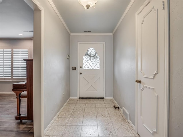 entryway featuring crown molding