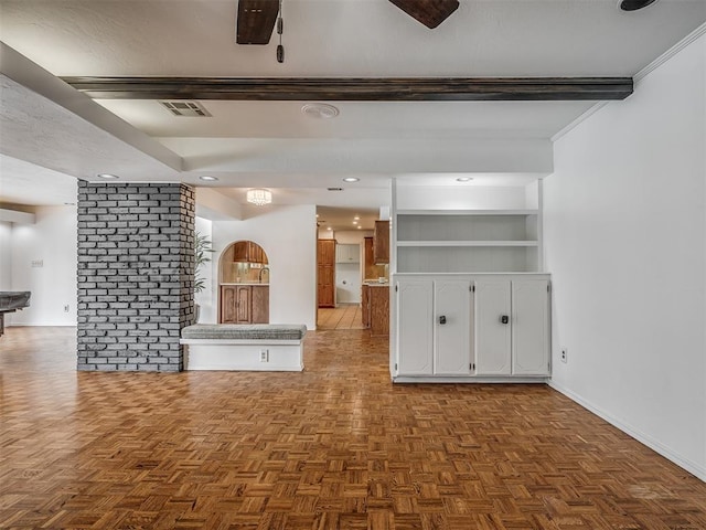 unfurnished living room with parquet floors, built in features, and ceiling fan