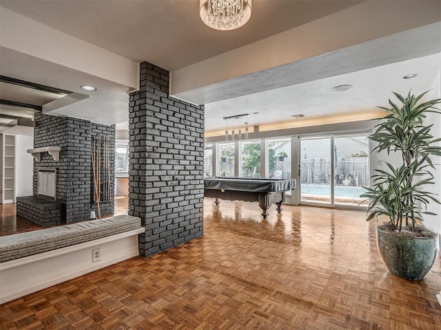 game room with parquet flooring, a fireplace, and billiards