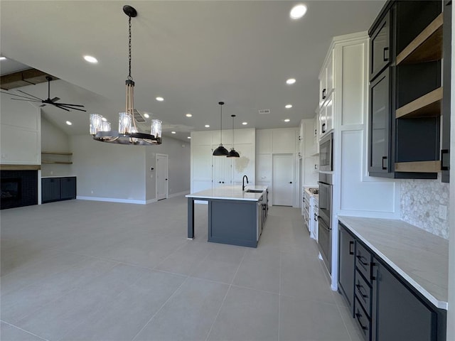 15521 Aparados Way, Edmond, OK 73013 - kitchen with recessed lighting, light countertops, light tile patterned floors, decorative backsplash, and open floor plan