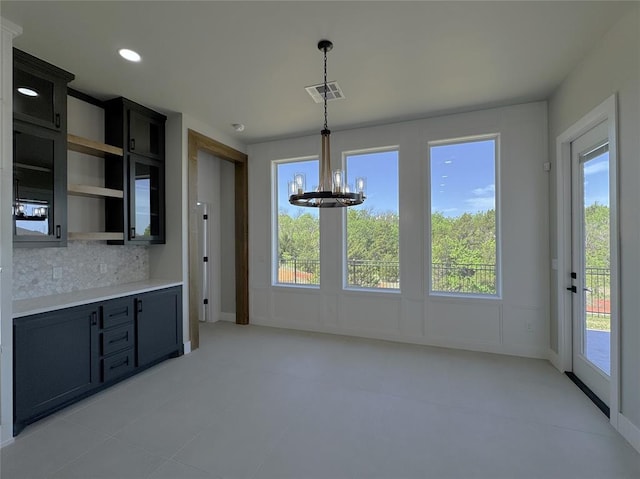 15521 Aparados Way, Edmond, OK 73013 - unfurnished dining area with an inviting chandelier, visible vents, and a wealth of natural light