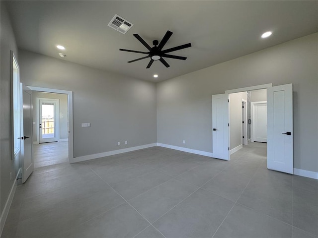 15521 Aparados Way, Edmond, OK 73013 - tiled spare room featuring recessed lighting, visible vents, a ceiling fan, and baseboards