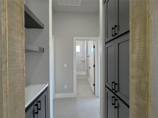 15521 Aparados Way, Edmond, OK 73013 - interior space with visible vents, baseboards, and light tile patterned floors