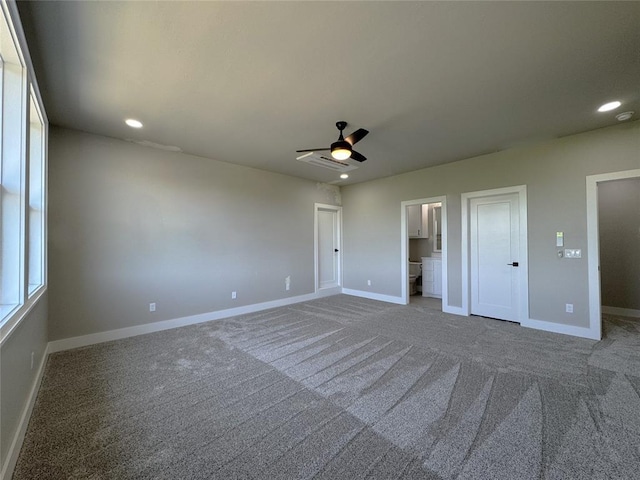 15521 Aparados Way, Edmond, OK 73013 - unfurnished bedroom featuring baseboards, ensuite bathroom, carpet flooring, and recessed lighting