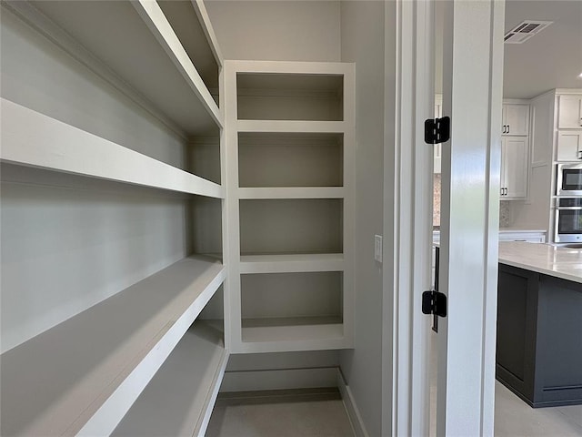 15521 Aparados Way, Edmond, OK 73013 - pantry featuring visible vents