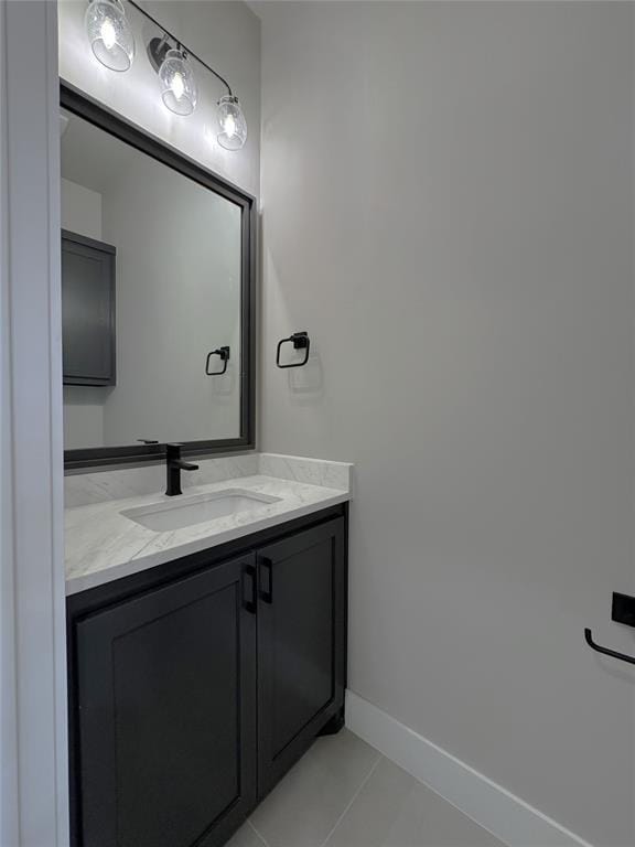 15521 Aparados Way, Edmond, OK 73013 - bathroom featuring baseboards, vanity, and tile patterned floors