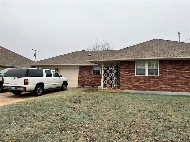 single story home with a garage and a front yard