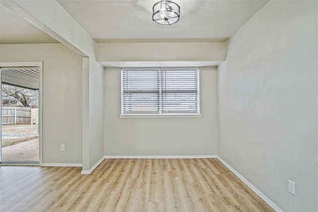 unfurnished room featuring light wood-type flooring