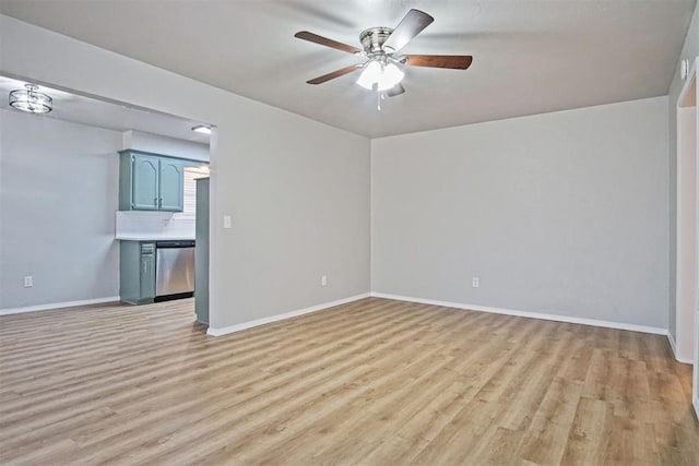 empty room featuring ceiling fan and light wood-type flooring