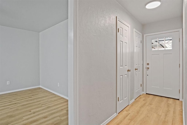 entryway with light hardwood / wood-style floors