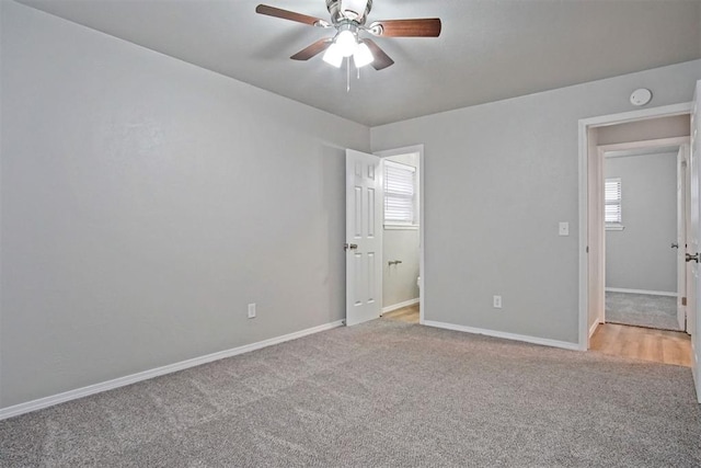 carpeted empty room with ceiling fan