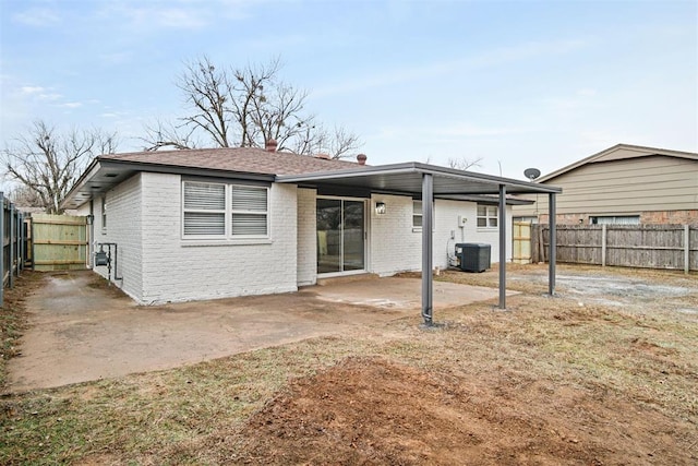 back of property featuring a patio and central air condition unit