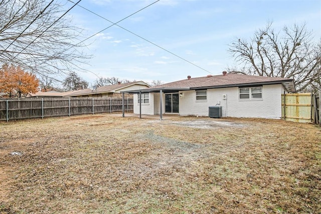 rear view of property featuring central air condition unit