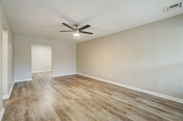 empty room with light hardwood / wood-style flooring and ceiling fan