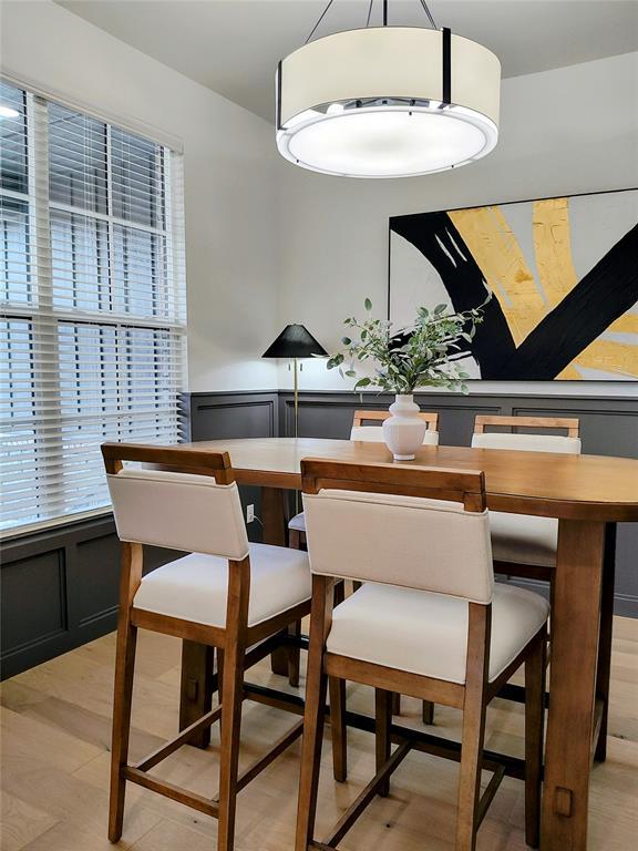 dining room with plenty of natural light and light wood-type flooring