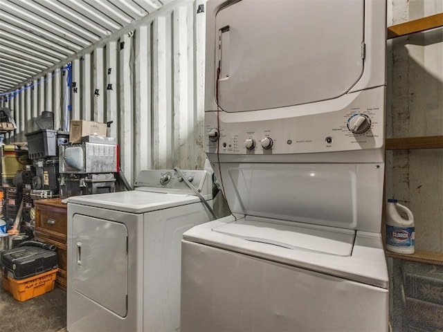 laundry area featuring stacked washer / dryer