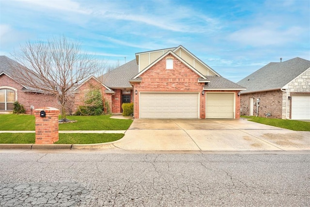 view of front property with a garage and a front yard