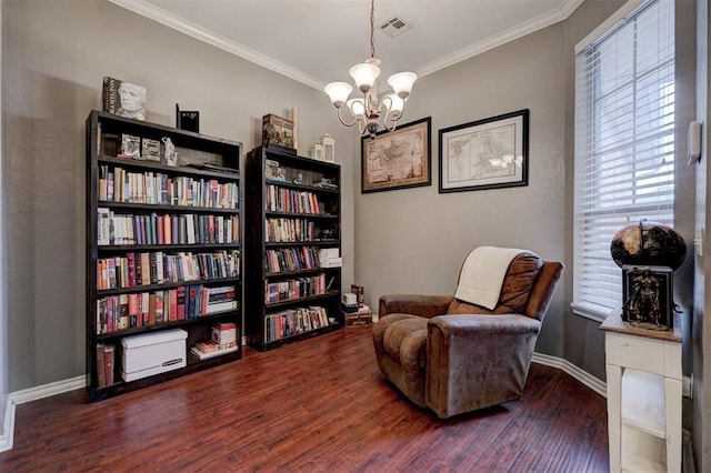 living area with ornamental molding, dark hardwood / wood-style floors, and a notable chandelier