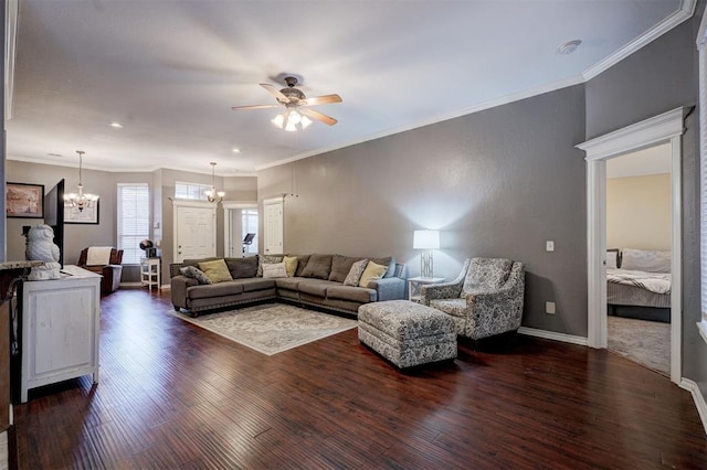 living room featuring ornamental molding, dark hardwood / wood-style floors, and ceiling fan with notable chandelier