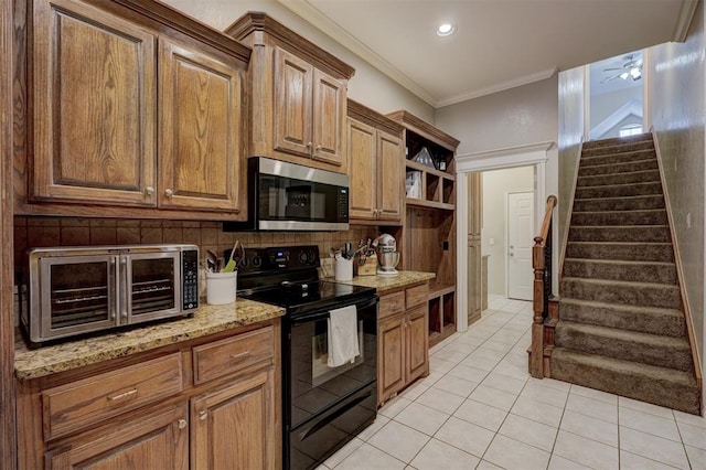 kitchen featuring backsplash, electric range, ornamental molding, light stone countertops, and light tile patterned flooring