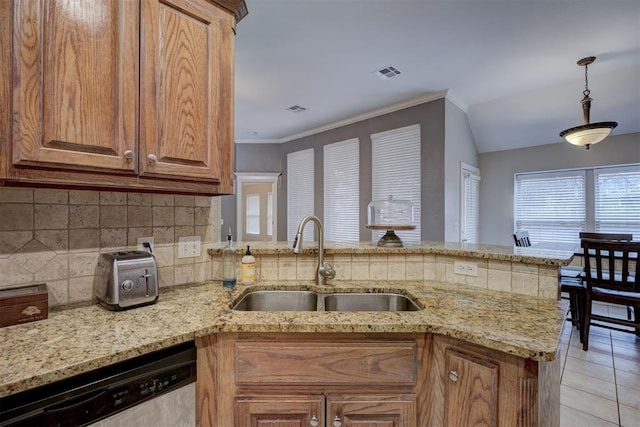 kitchen featuring sink, tasteful backsplash, light tile patterned floors, stainless steel dishwasher, and kitchen peninsula