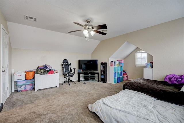 carpeted bedroom featuring vaulted ceiling and ceiling fan