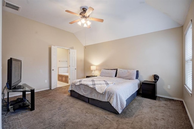 carpeted bedroom with ensuite bathroom, lofted ceiling, and ceiling fan